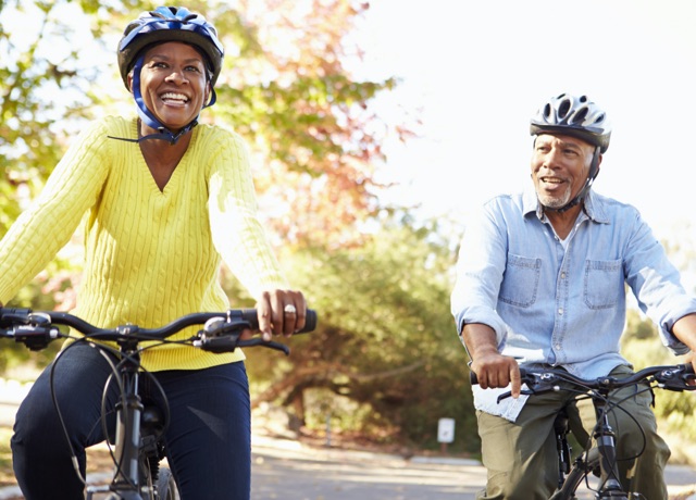 African American couple riding bikes