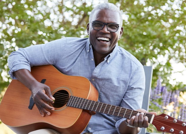African American man playing the guitar